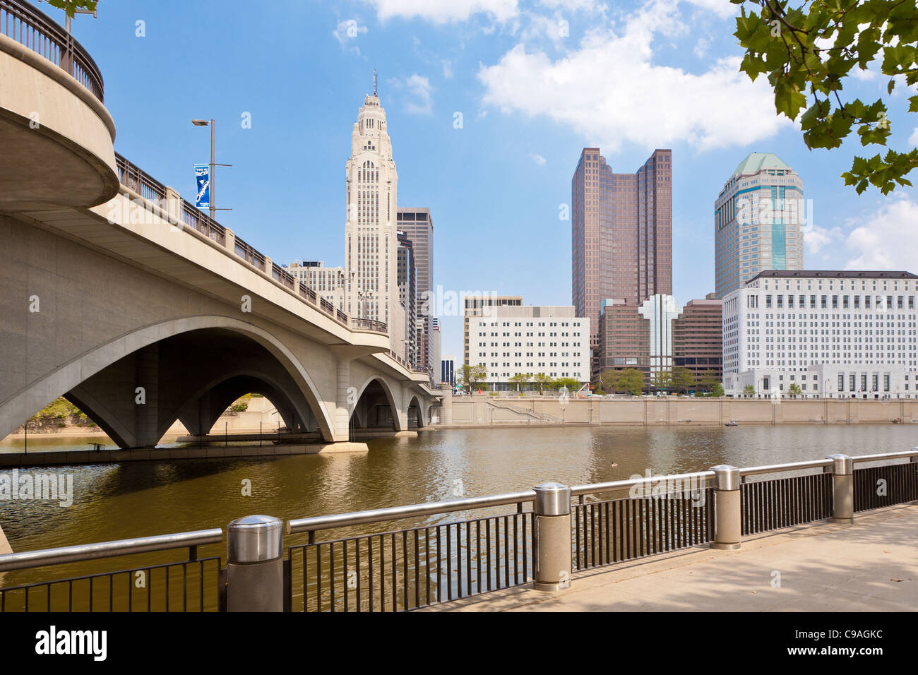 Cityscape of downtown Columbus, Ohio as seen from foot of Broad Street Bridge across the Scioto River. Stock Photo