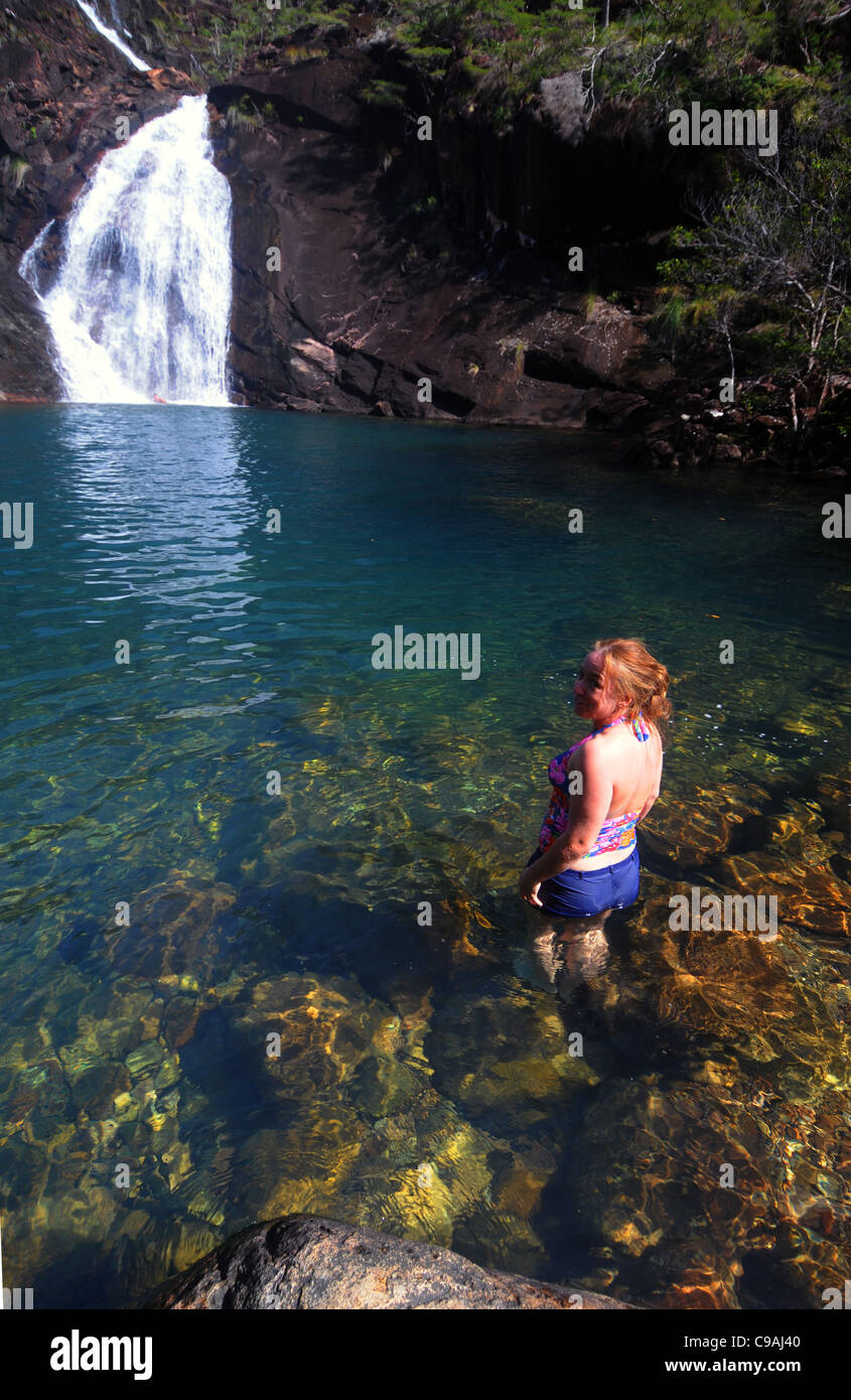 Woman about to swim at Zoe Falls, Hinchinbrook Island National Park, Queensland, Australia. No MR Stock Photo