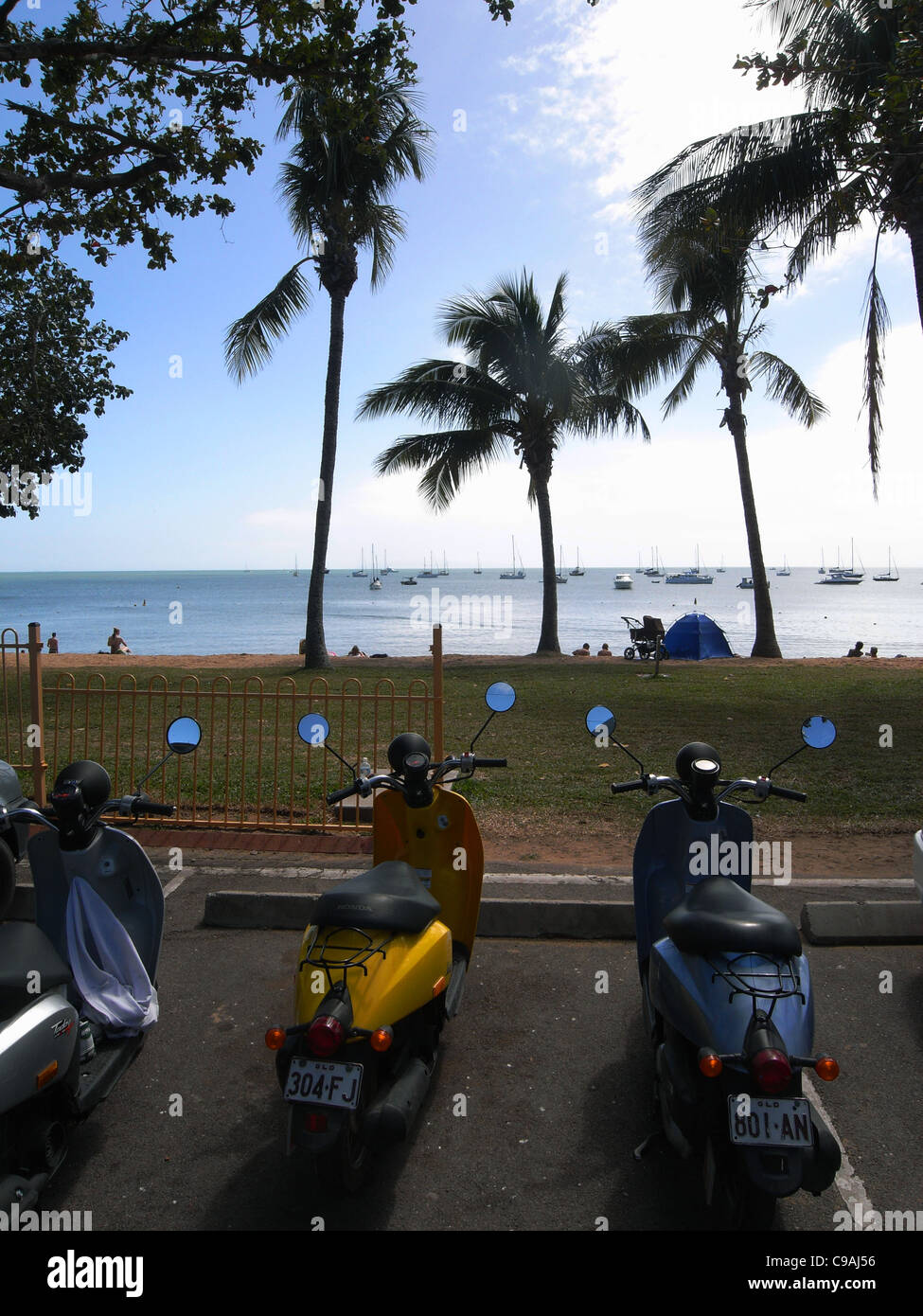 Mopeds parked on the foreshore at Horseshoe Bay, Magnetic Island, near Townsville, Queensland, Australia. No PR Stock Photo