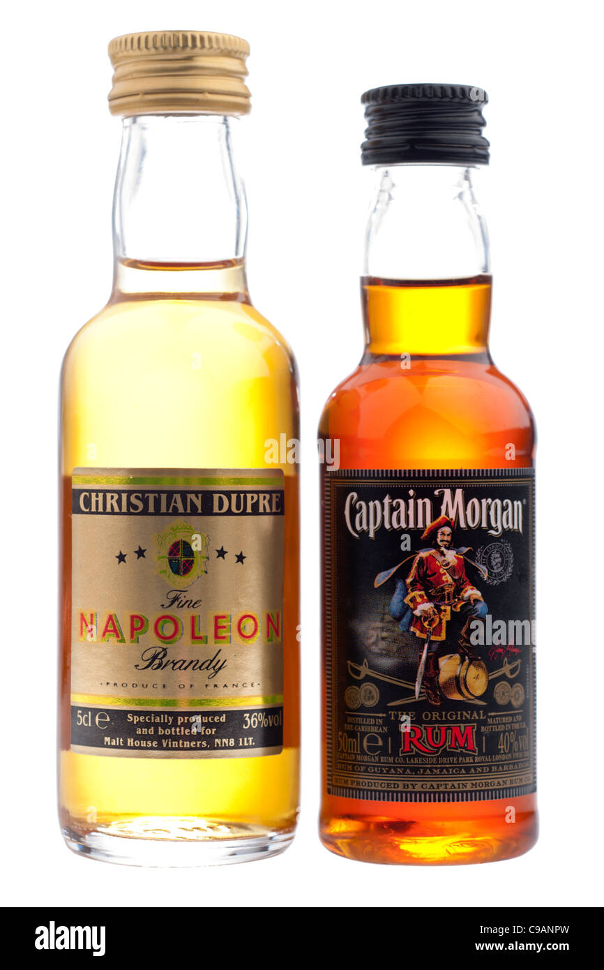 Two miniature bottles of spirits a 5 cl bottle of Christian Dupre fine Napoleon brandy and a 50ml of Captain Morgan rum Stock Photo