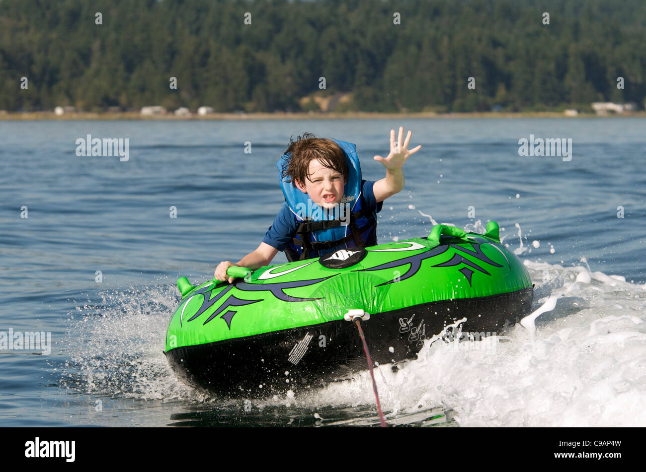 Young Boy Inner Tubing (Tubing Stock Photo - Alamy