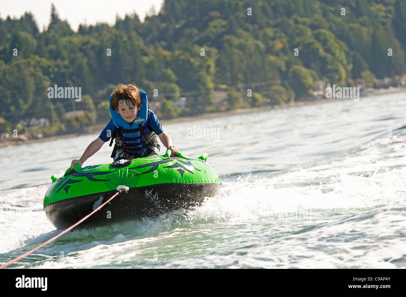 Young Boy Inner Tubing (Tubing Stock Photo Alamy
