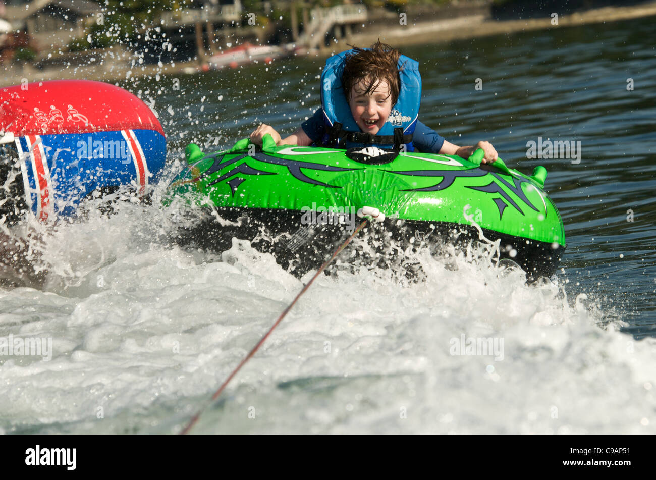 Young Boy Inner Tubing (Tubing Stock Photo Alamy