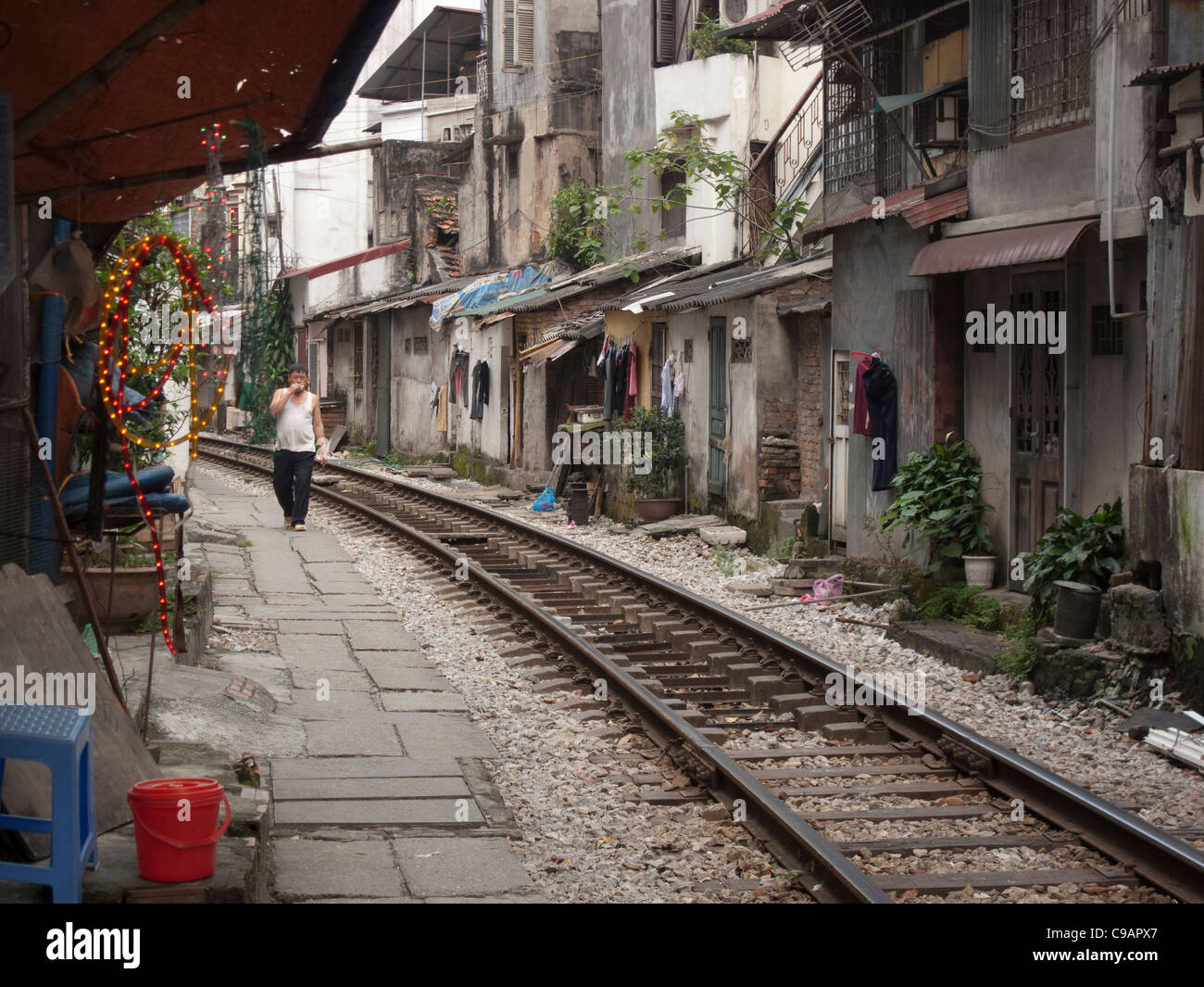 Rail track through housing in Hanoi, Vietnam Stock Photo Alamy