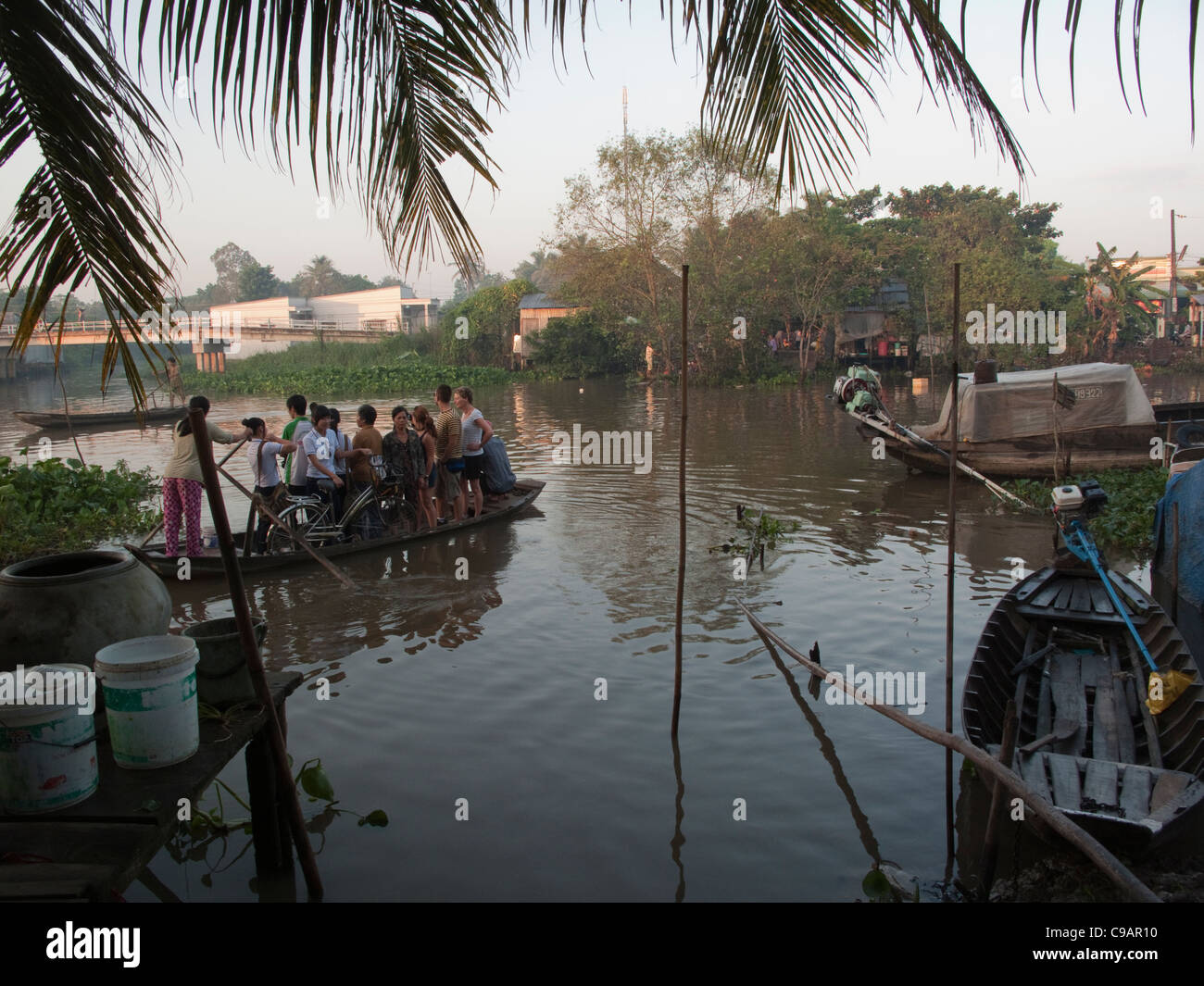 River ferry carrying standing passengers on the Mekong Delta, Vietnam ...