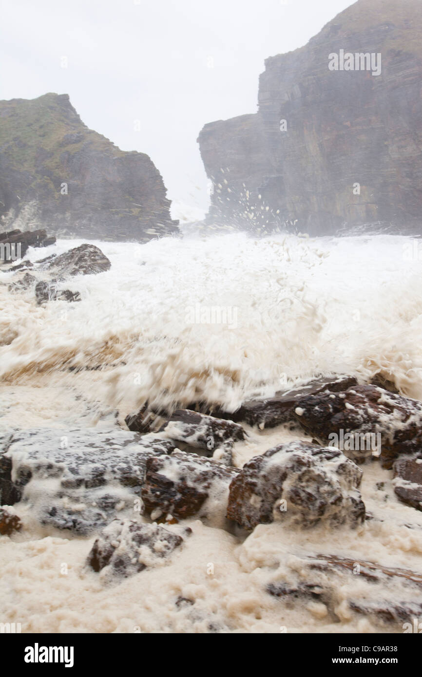 A storm battering Orkney mainland coast, with waves crashing over the 80 foot cliffs of Mull Head on Deerness. Stock Photo