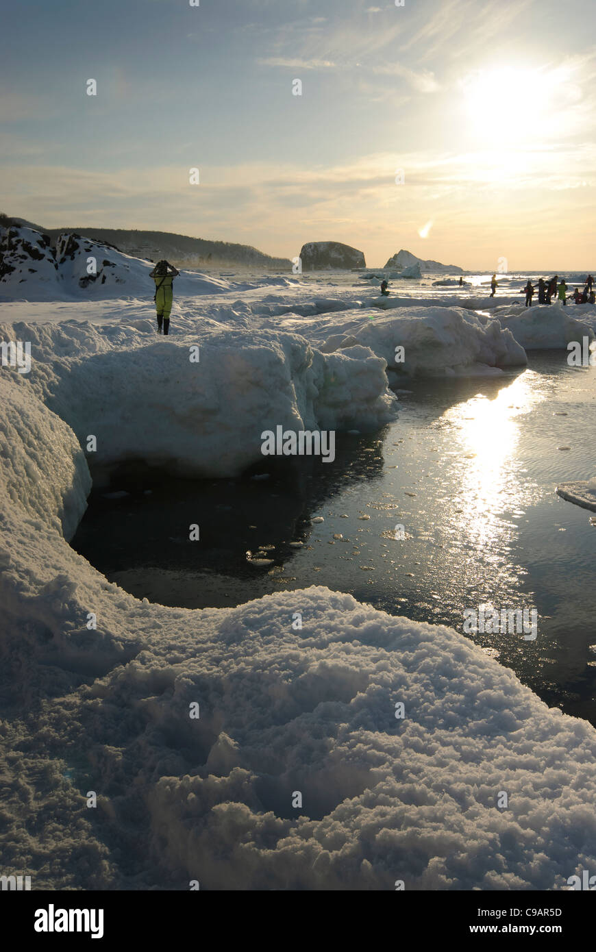 Tourists exploring frozen coastline, Shiretoko and Nemuro, Hokkaido, Japan Stock Photo