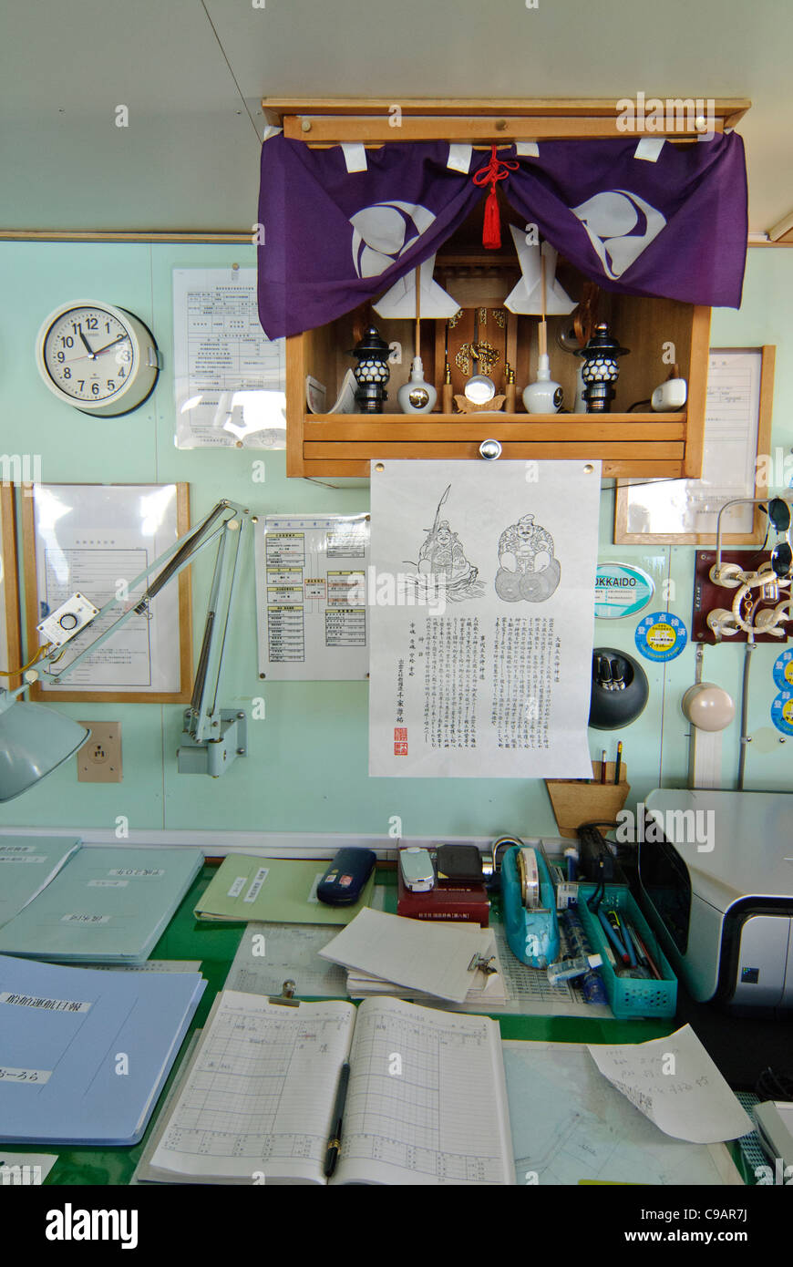 Interior of ship, showing desk with paperwork, Shiretoko and Nemuro, Hokkaido, Japan Stock Photo