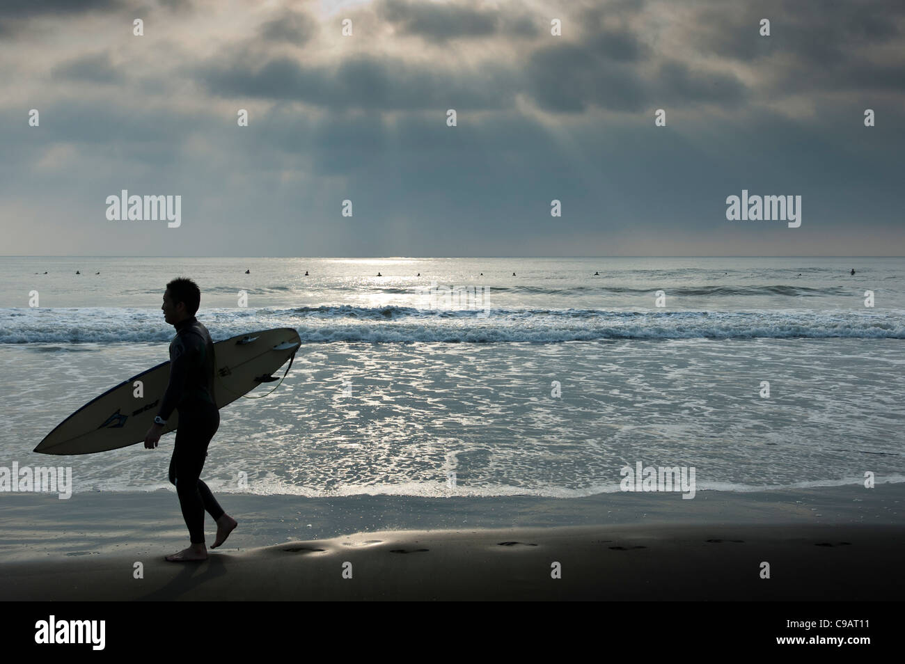 Japan surfing surfer sunrise sunlight Stock Photo
