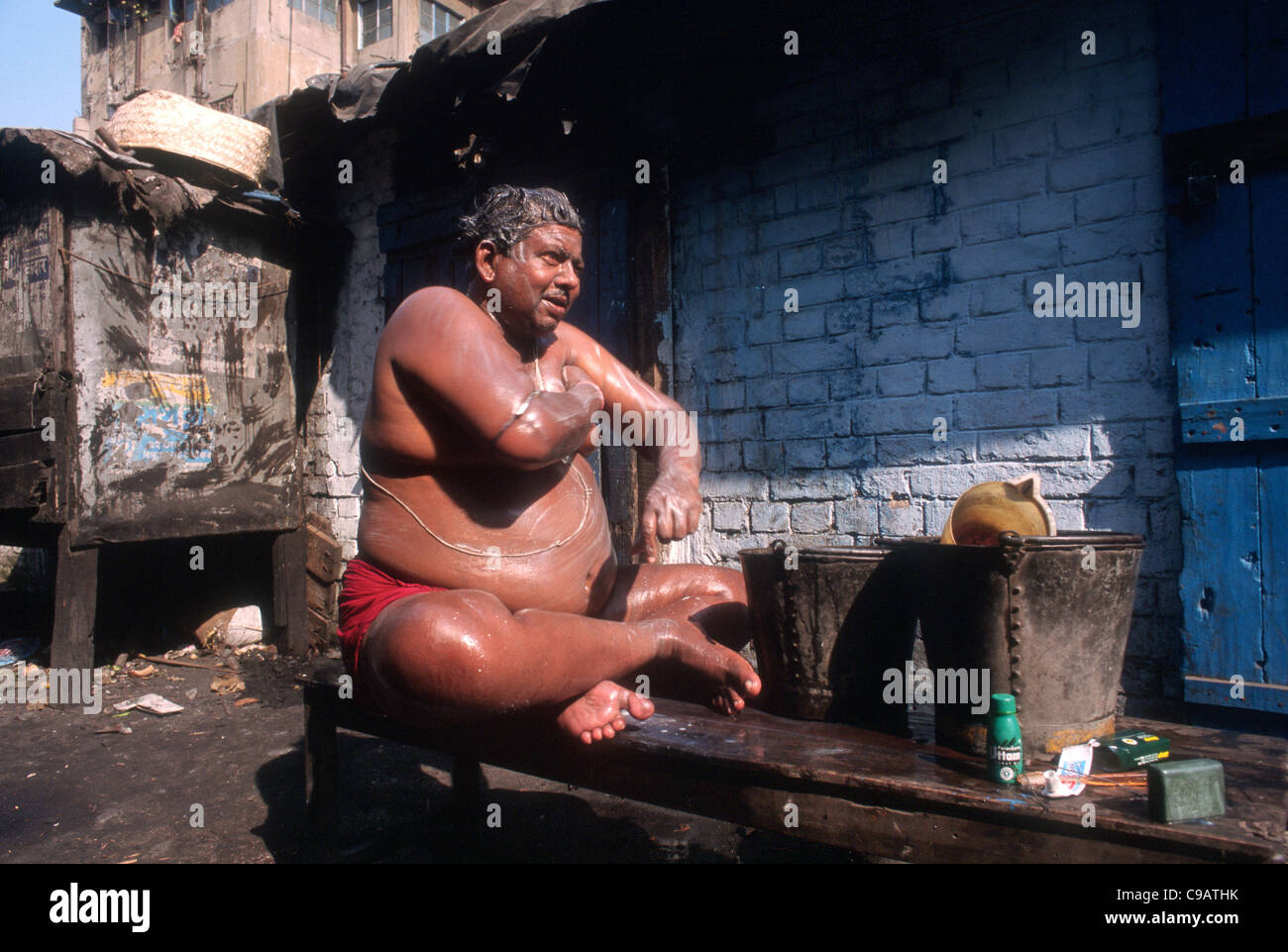 Man ashing. Slums of calcutta, India Stock Photo