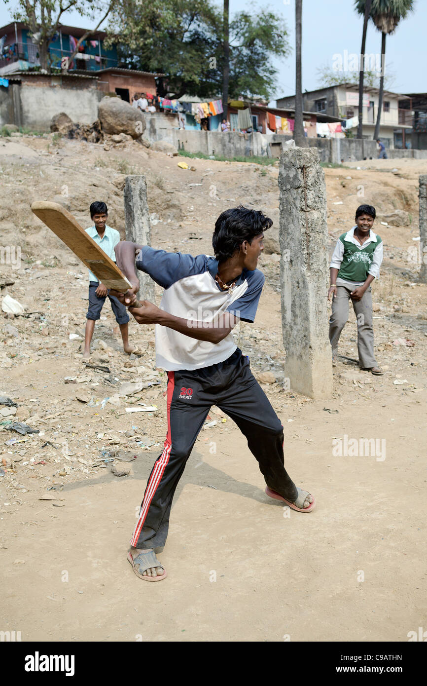 Cricket match in Subash Nagar slum area in Mumbai, India. Stock Photo