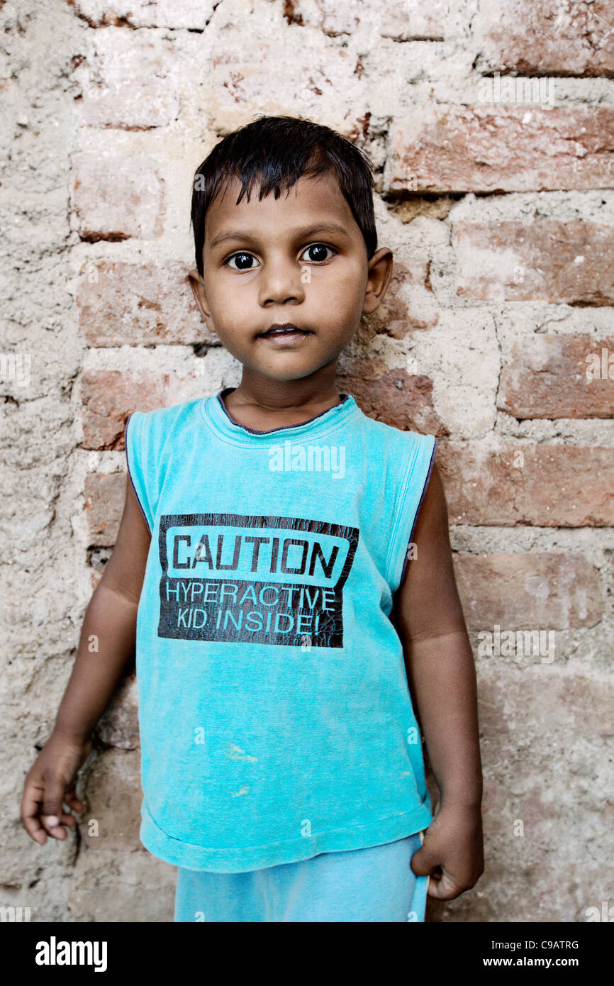 Small boy on street in Subash Nagar slum area in Mumbai, India. Stock Photo