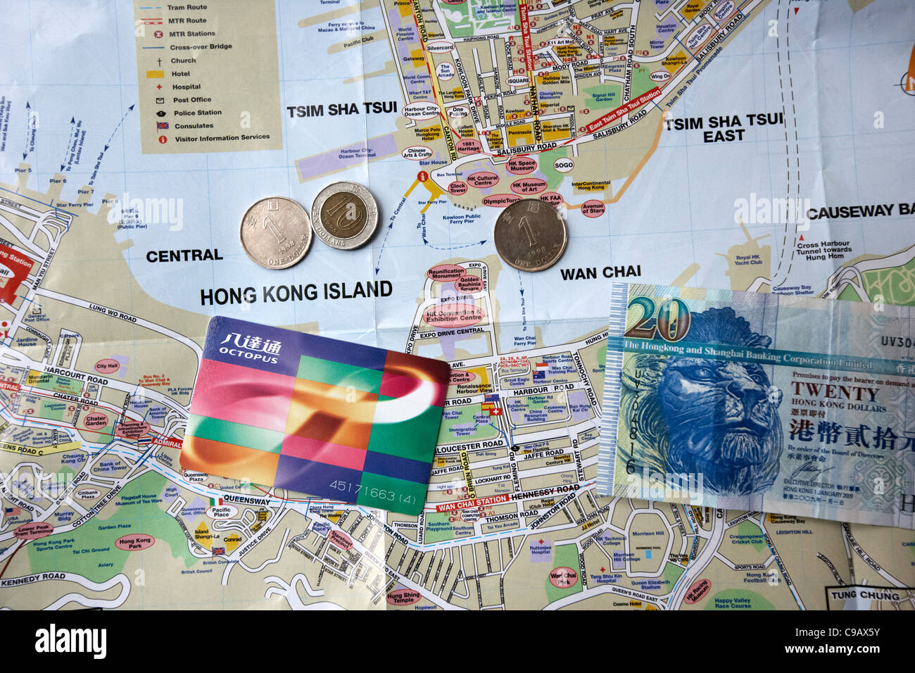 tourist map of hong kong with octopus travel card and hong kong dollars cash Stock Photo Alamy