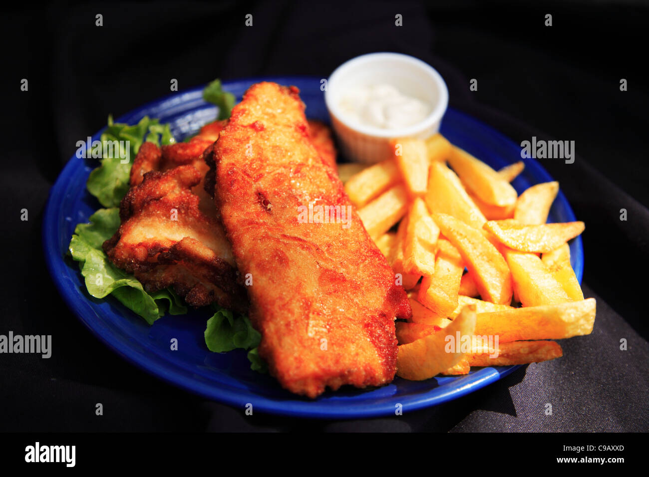 Beer battered fish and chips, shot with a shallow depth of field Stock Photo