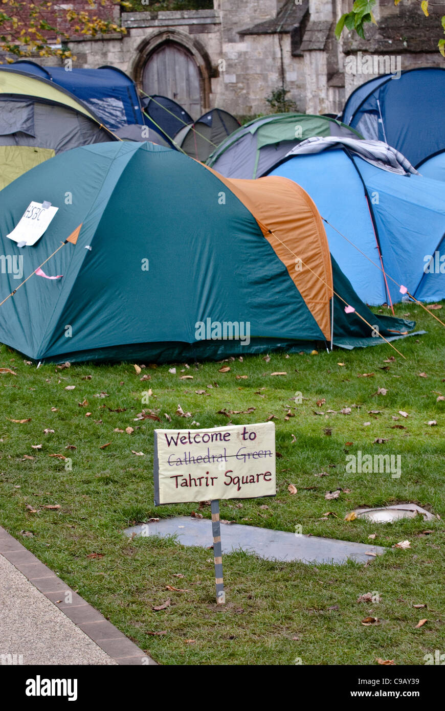 Exeter, UK. 19th Nov, 2011. A 'Welcome to Tahrir Square' sign in front of the tents at the Occupy Exeter Camp on Exeter Cathedral Green Stock Photo