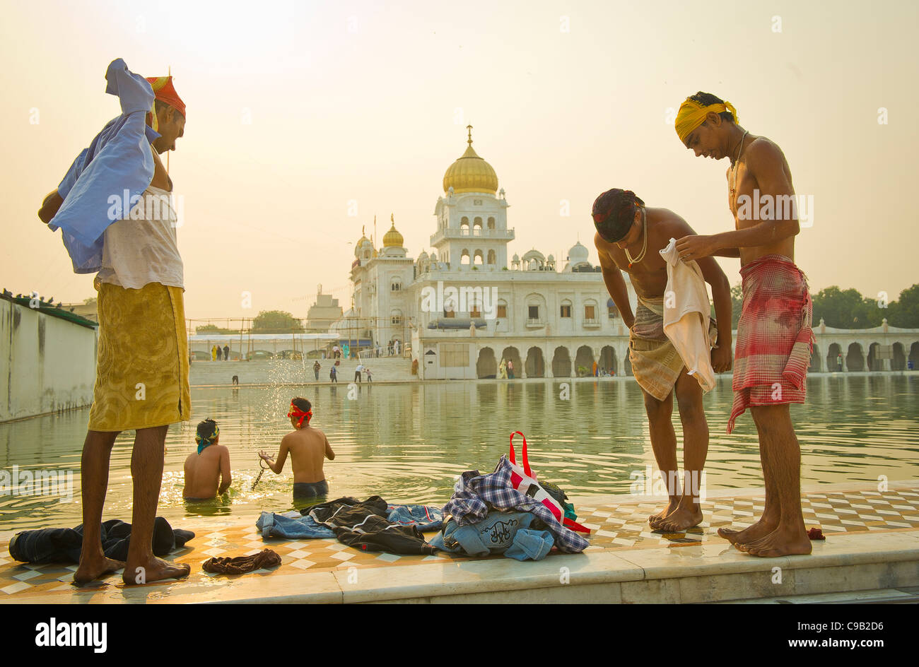 Sikhs bath in the early morning at the Gurdwara Bangla Sahib in New