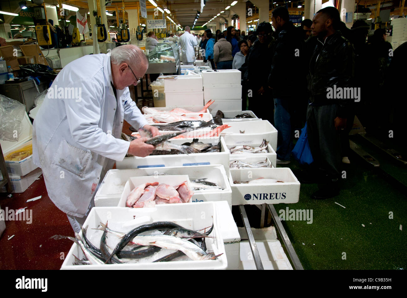 Billingsgate Fish Market in London. Workers sell their fresh fish to