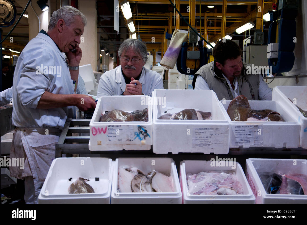 Billingsgate Fish Market in London. Workers sell their fresh fish to