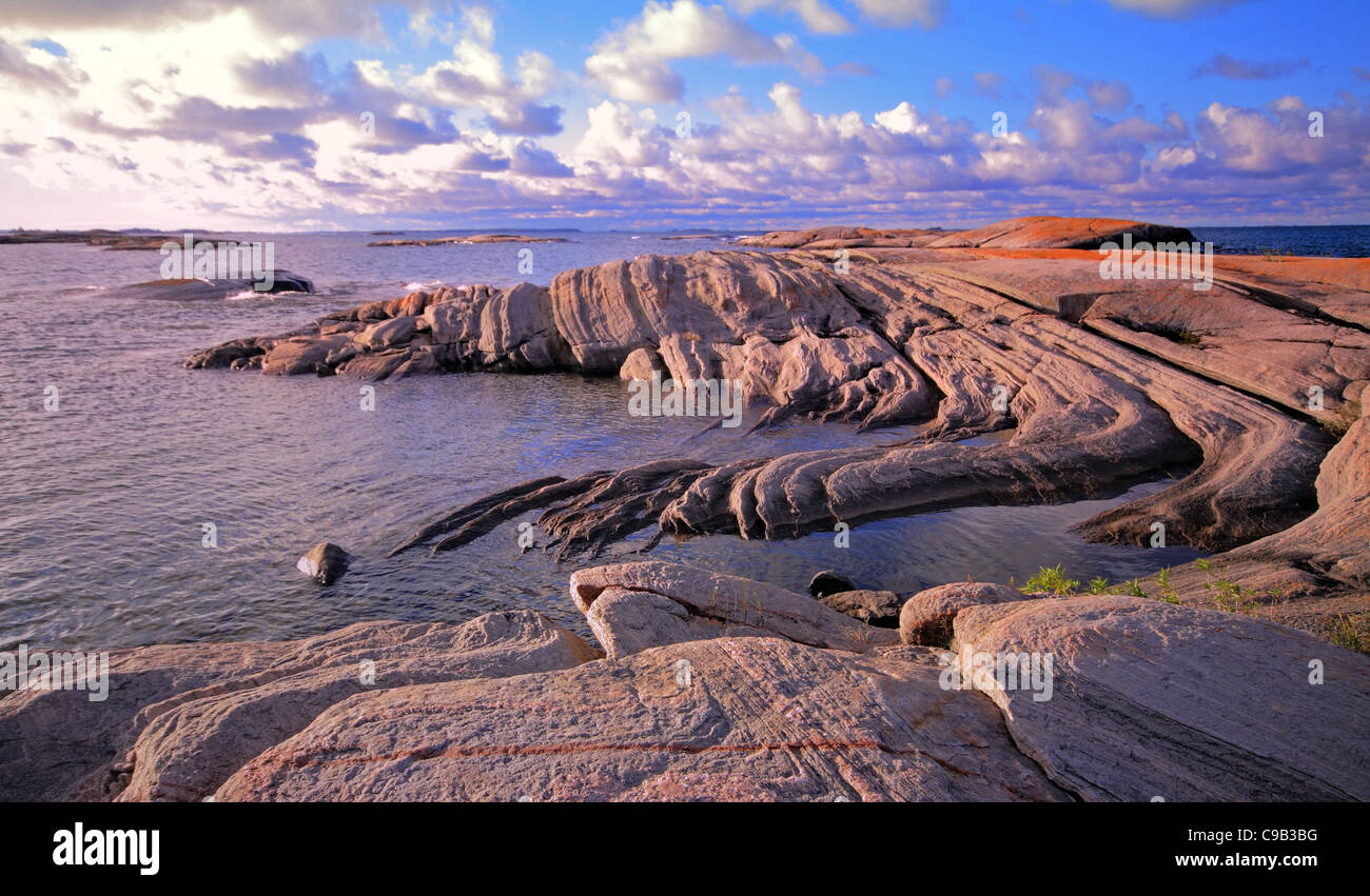 Dramatic rocky shoreline in one of the Thirty Thousand Islands in Georgian Bay, Ontario, Canada Stock Photo