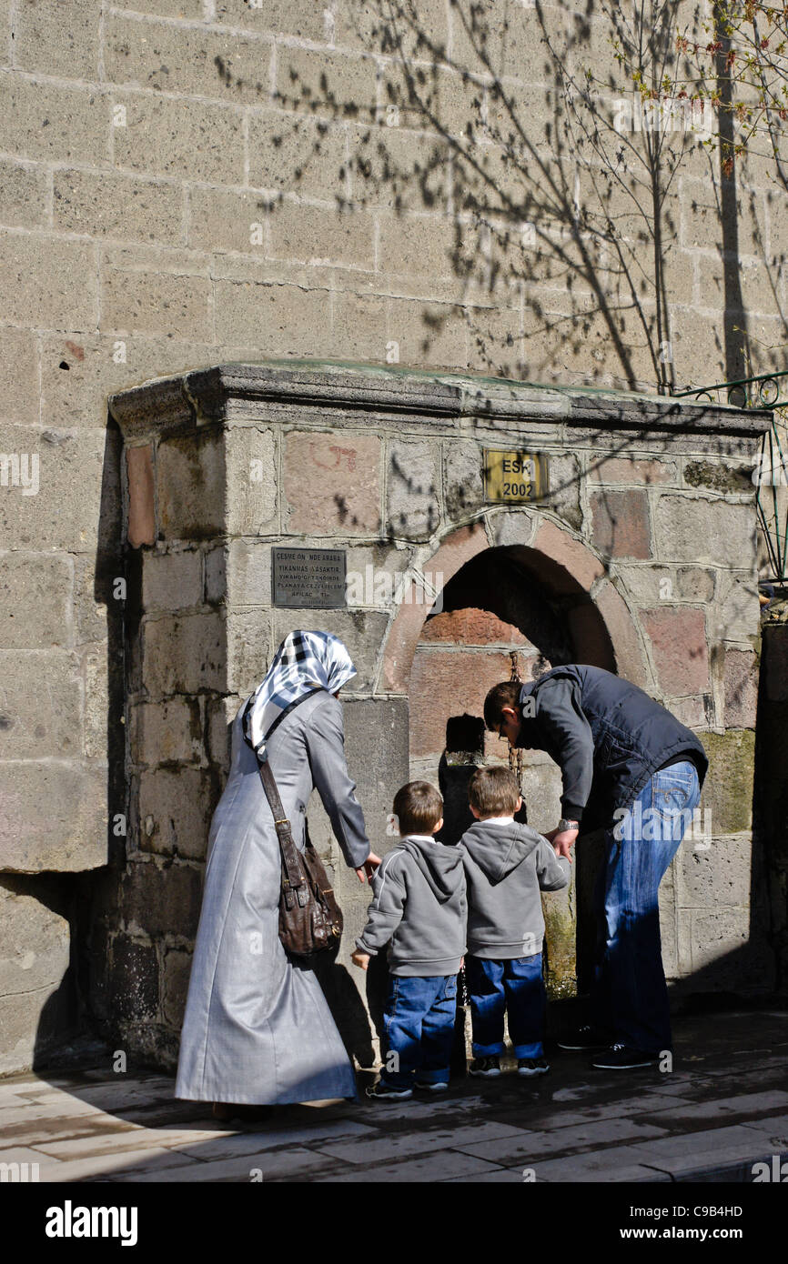 Muslim family washing before entering mosque, Erzurum, Eastern Anatolia
