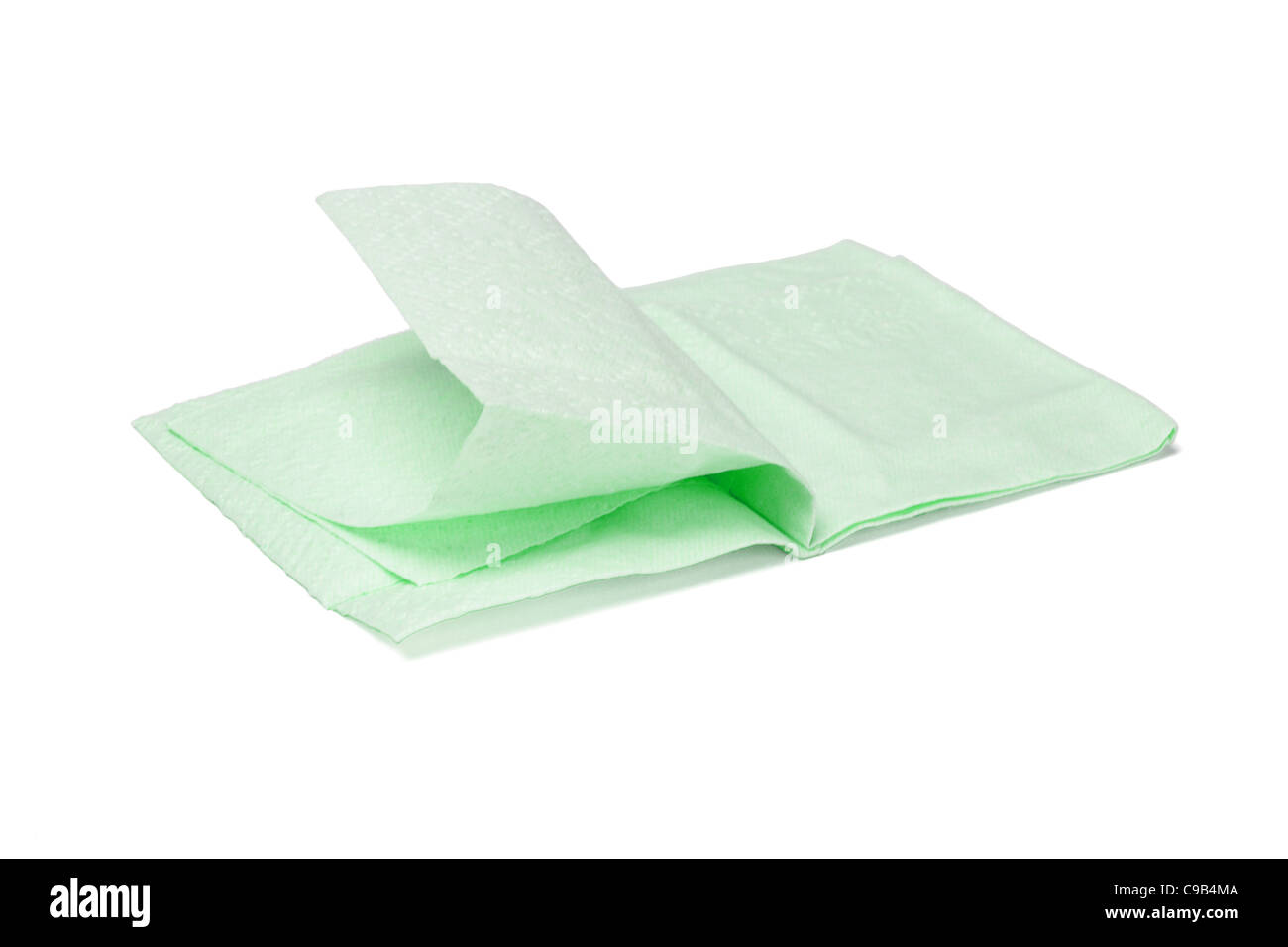 Green folded facial tissue paper on white background Stock Photo