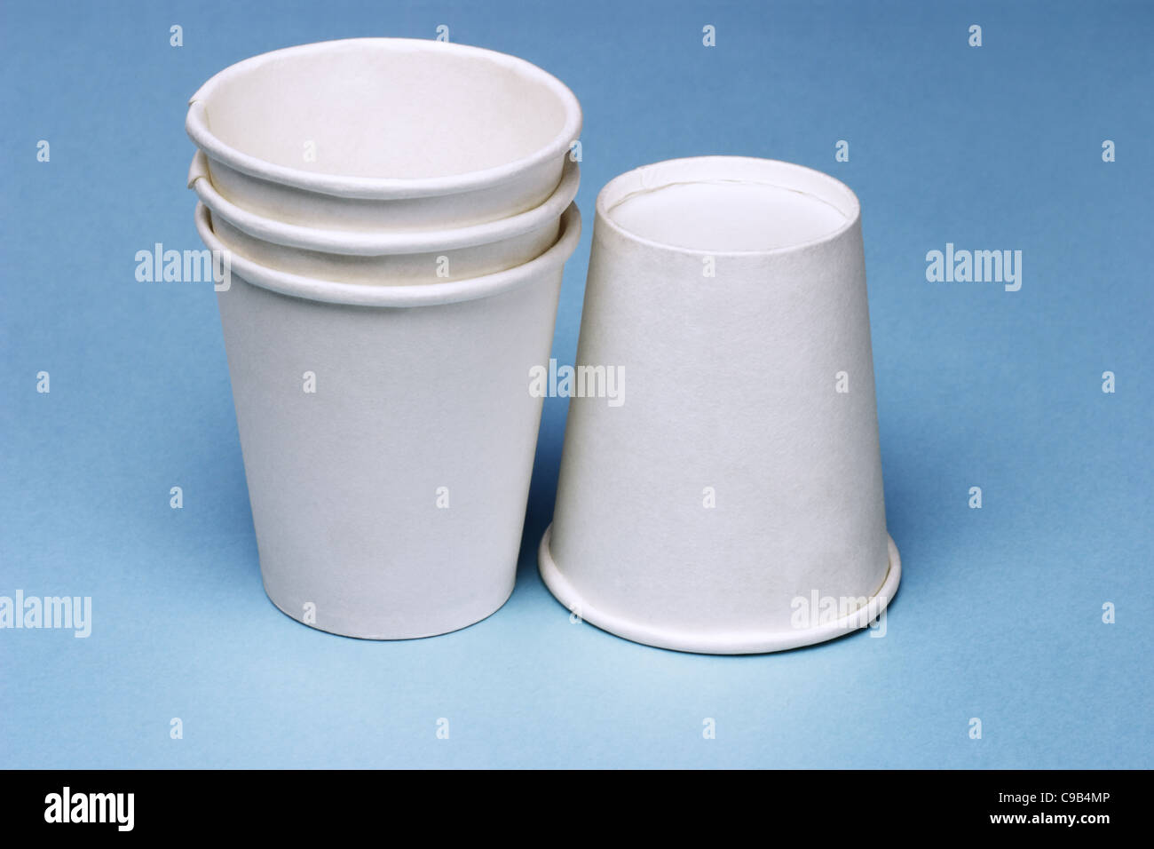 https://c8.alamy.com/comp/C9B4MP/stack-of-disposable-paper-cups-on-blue-background-C9B4MP.jpg