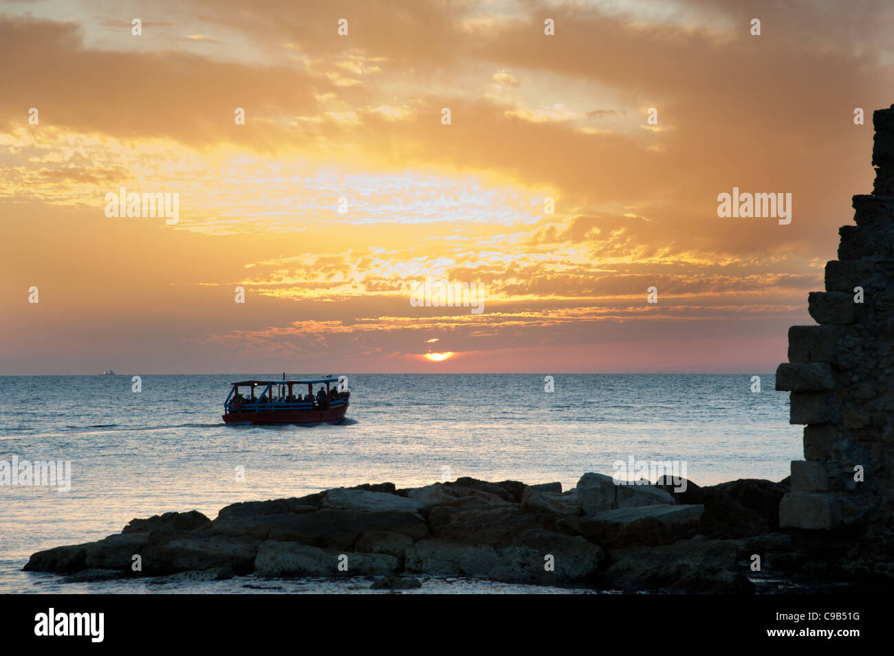 The sun sets over the Mediterranean Sea at Akko (Acre), Israel. Stock Photo