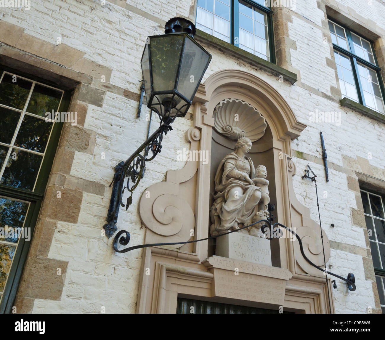 Detail of building on the green in the walled 13th century Begijnhof or Béguinage, in Bruges, Belgium. Stock Photo