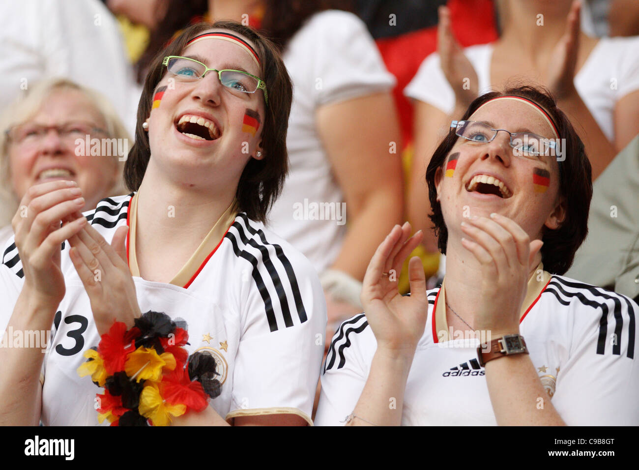 Germany supporters cheer at a 2011 FIFA Women's World Cup Group A match between France and Germany at Stadion im Borussia Park. Stock Photo
