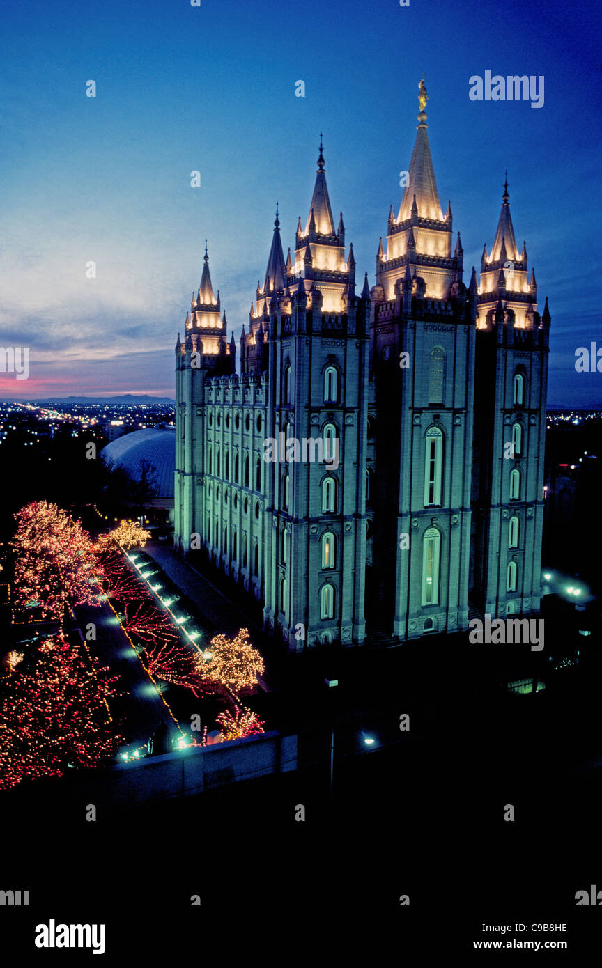 The Salt Lake Temple is the best-known temple of The Church of Jesus Christ of Latter-Day Saints (LDS) and glows at dusk in Salt Lake City, Utah, USA. Stock Photo