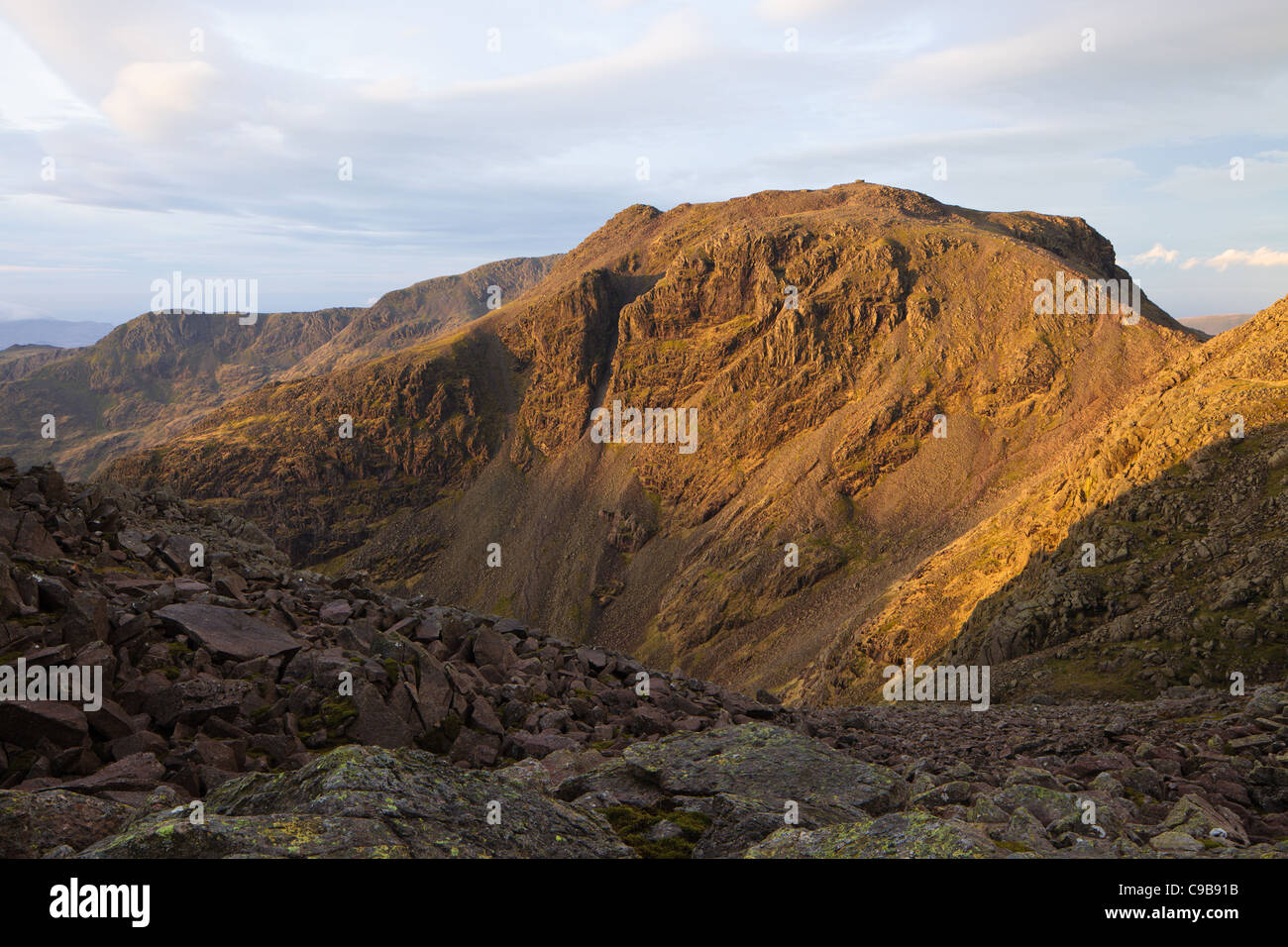 Scafell Pike, English Lake District, England's highest mountain. Viewed from Ill Crag shortly after sunrise. No people in view. Stock Photo