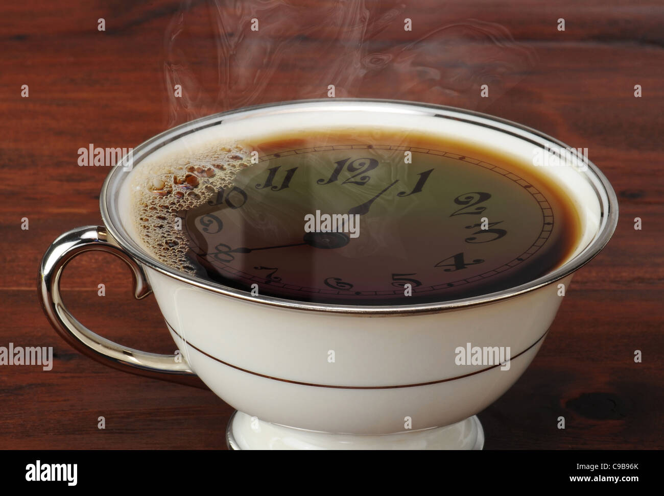Coffee Time. Clock face reflected into coffee Stock Photo Alamy