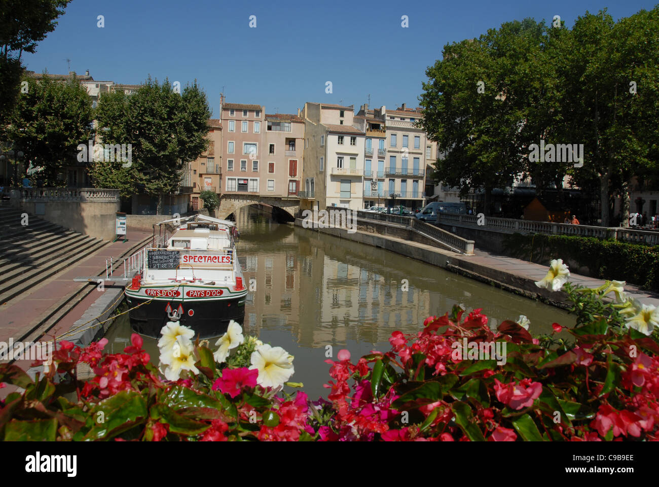 Houseboat on the Canal de la Robine, linking Narbonne to the Canal du Midi and the Mediterranean Sea Stock Photo