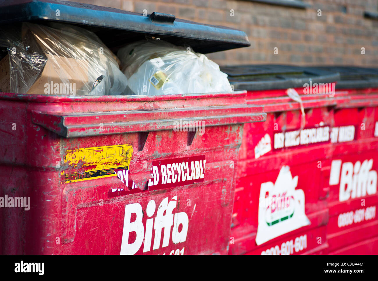 'Biffa' Refuse Bins with Rubbish Inside. Stock Photo