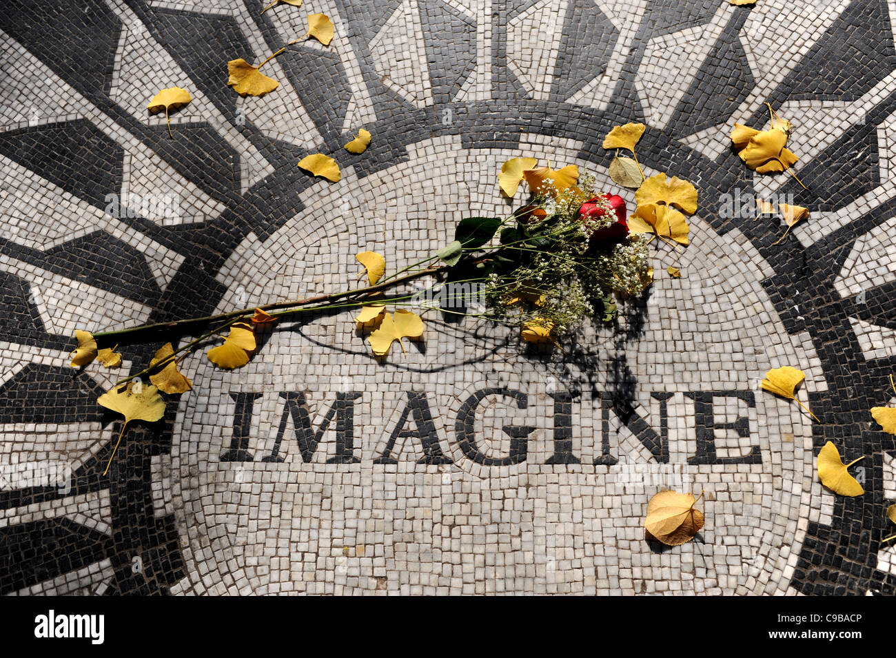 The Imagine mosaic with red rose at the Strawberry Fields memorial site for John Lennon Central Park Manhattan New York NYC USA Stock Photo