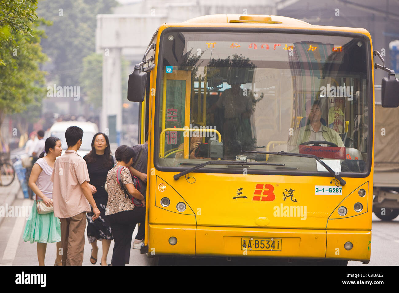 GUANGZHOU, GUANGDONG PROVINCE, CHINA Boarding bus in the city of