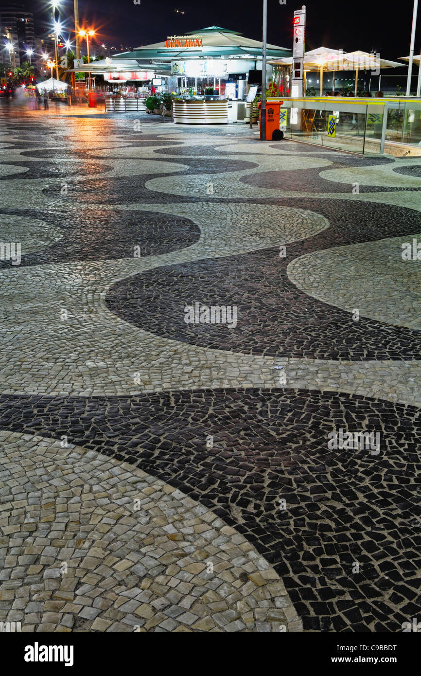 Wave Patterned Walkway with Kiosks at Night, Copacabana, Rio de Janeiro, Brazil Stock Photo