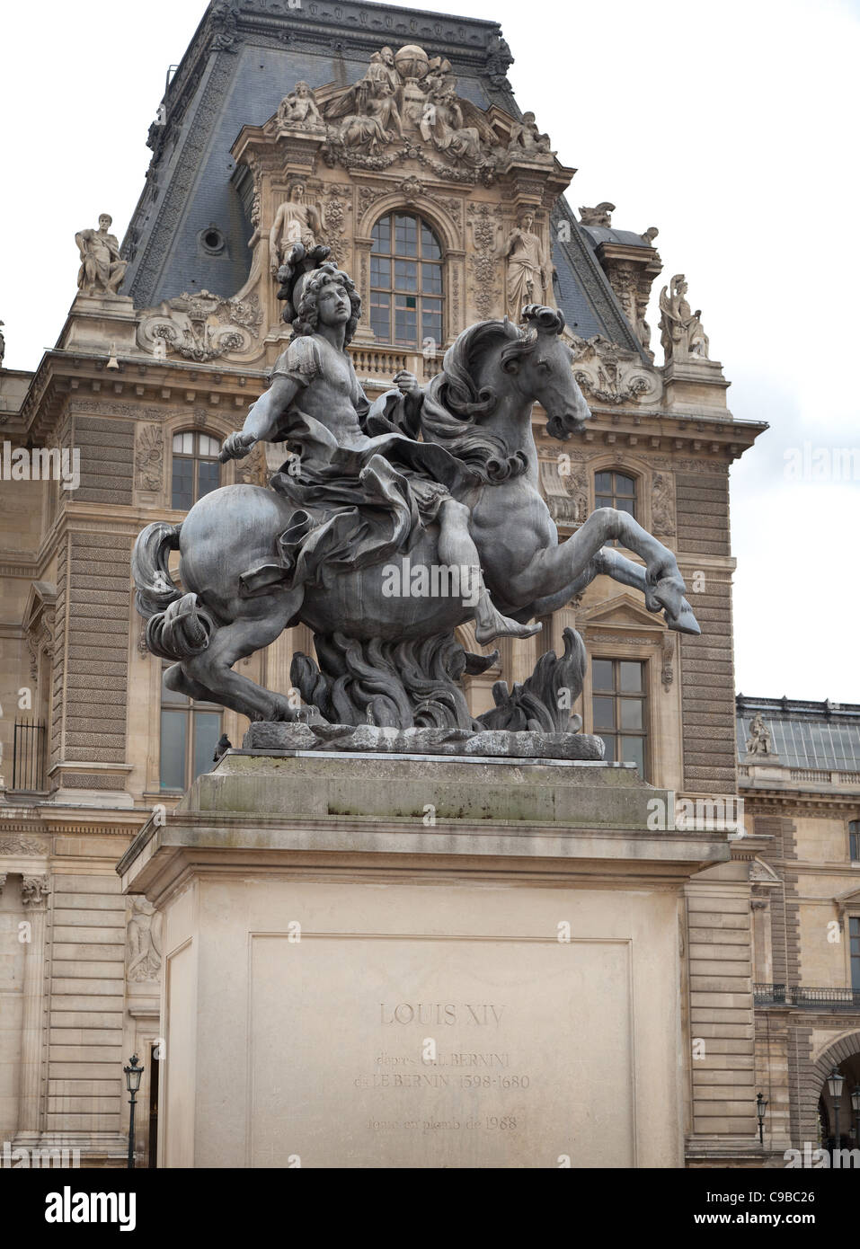 Louis XIV equestrian statue on plinth, The Louvre central courtyard, Paris, France Stock Photo