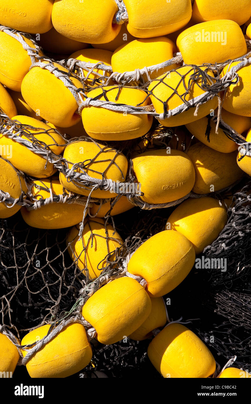 Fishermen's Terminal close up of stacked yellow fishing nets along dock ...
