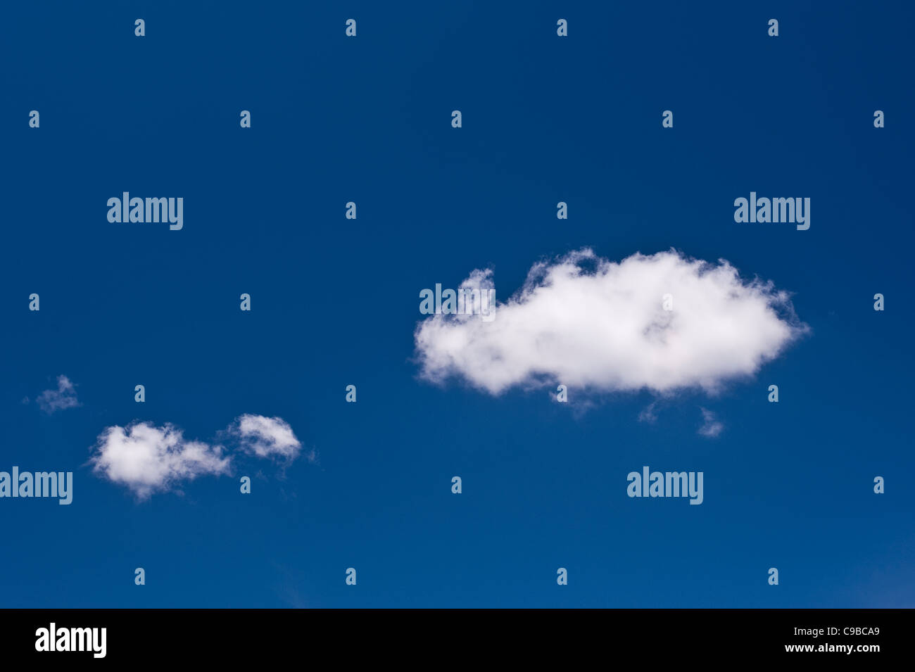 White fluffy cumulus clouds in blue sky Stock Photo - Alamy