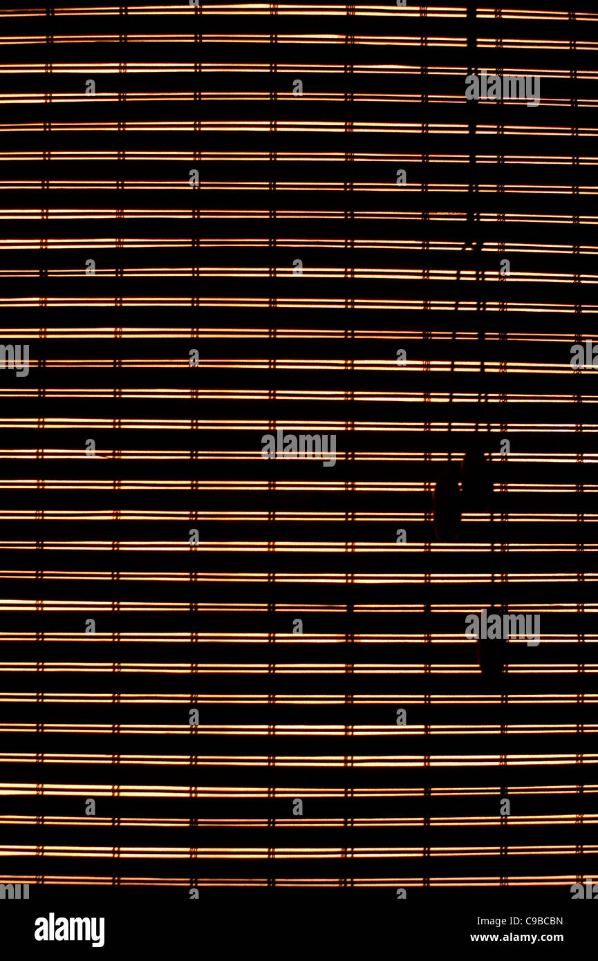 Back lit window bamboo blinds closed Stock Photo