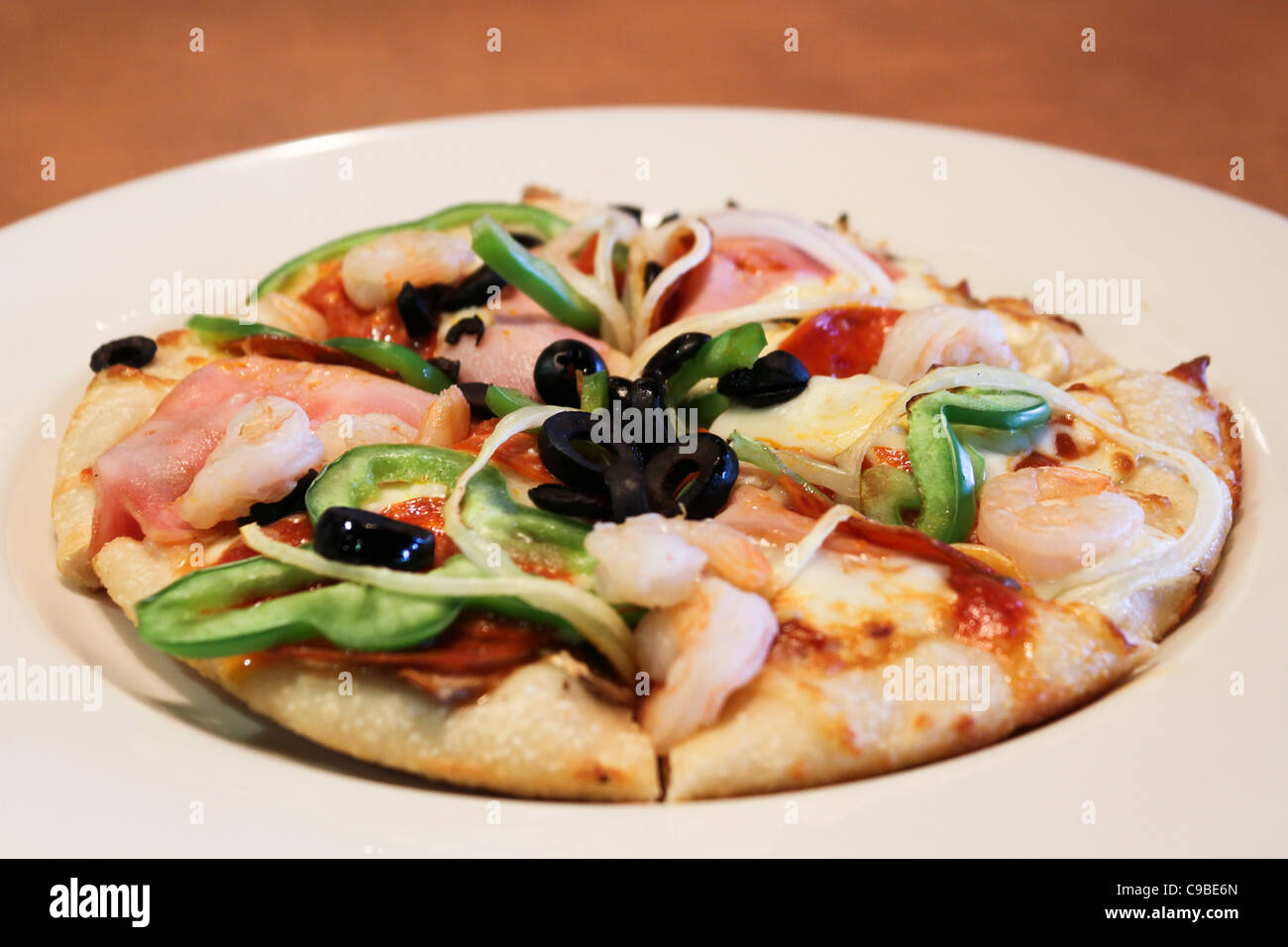 pizza green pepper shrimp olive white plate Stock Photo Alamy