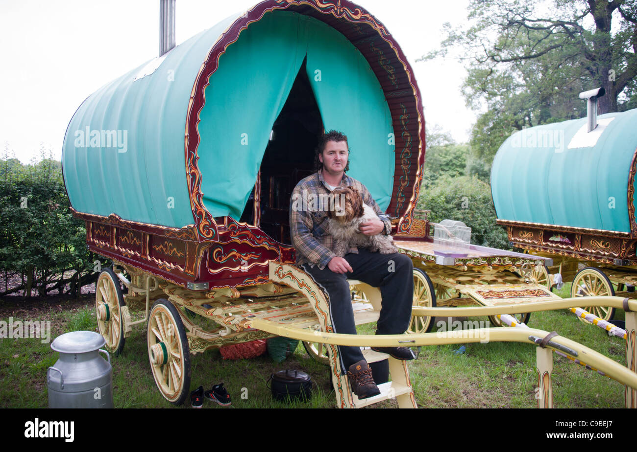 Traveler with dog and Romany caravan Stock Photo