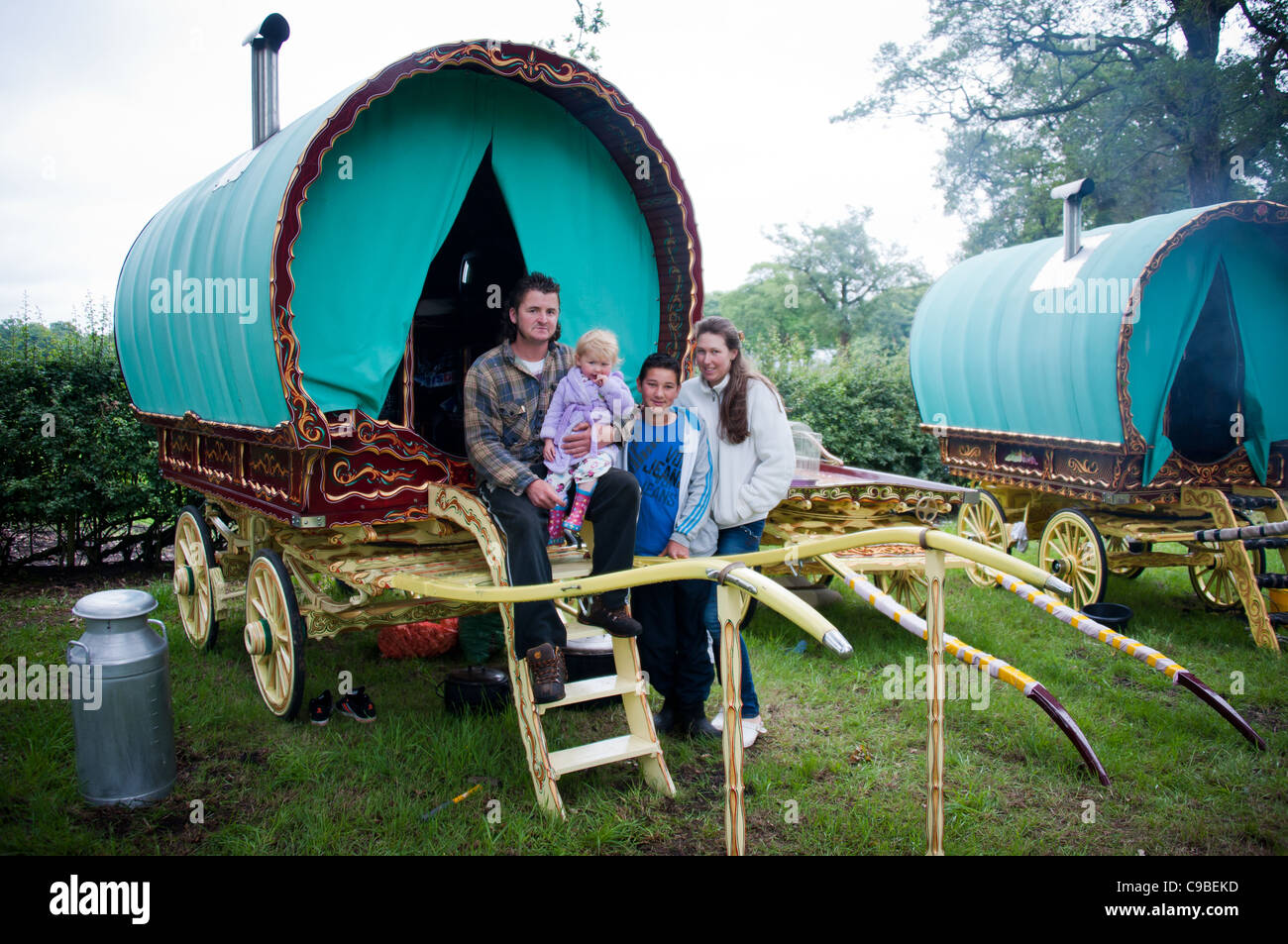 Traveler family and Romany caravan Stock Photo