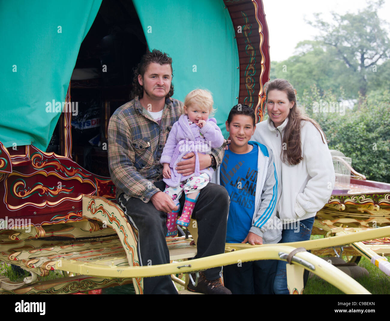 Traveler family and Romany caravan Stock Photo