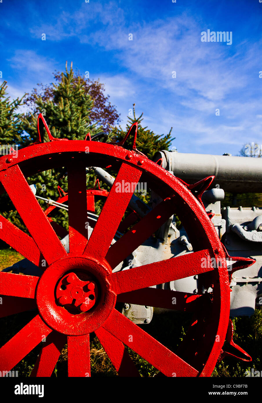 Colorful abstract of a old Fordson tractor wheel close up and blue sky,  New Jersey,  USA, NJ, US,  United States, POV vertical farming tools, vintage Stock Photo