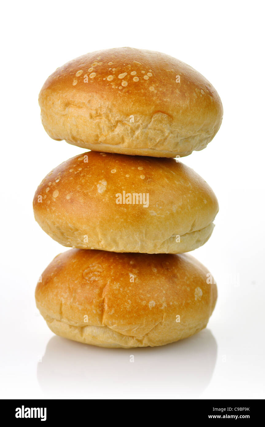 a stack of fresh breakfast rolls on a white background Stock Photo