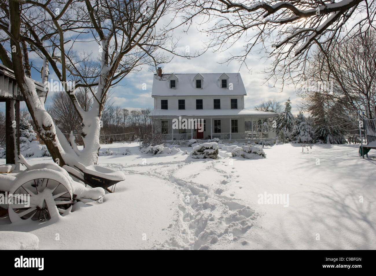 Snow covered farmhouse Stock Photo