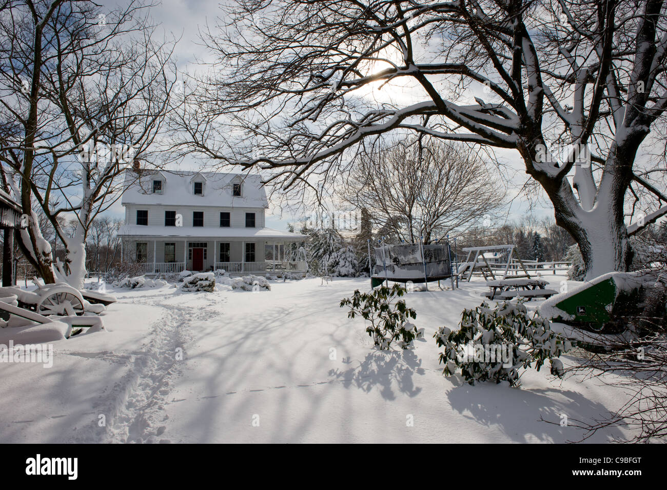 Snow covered farmhouse Stock Photo