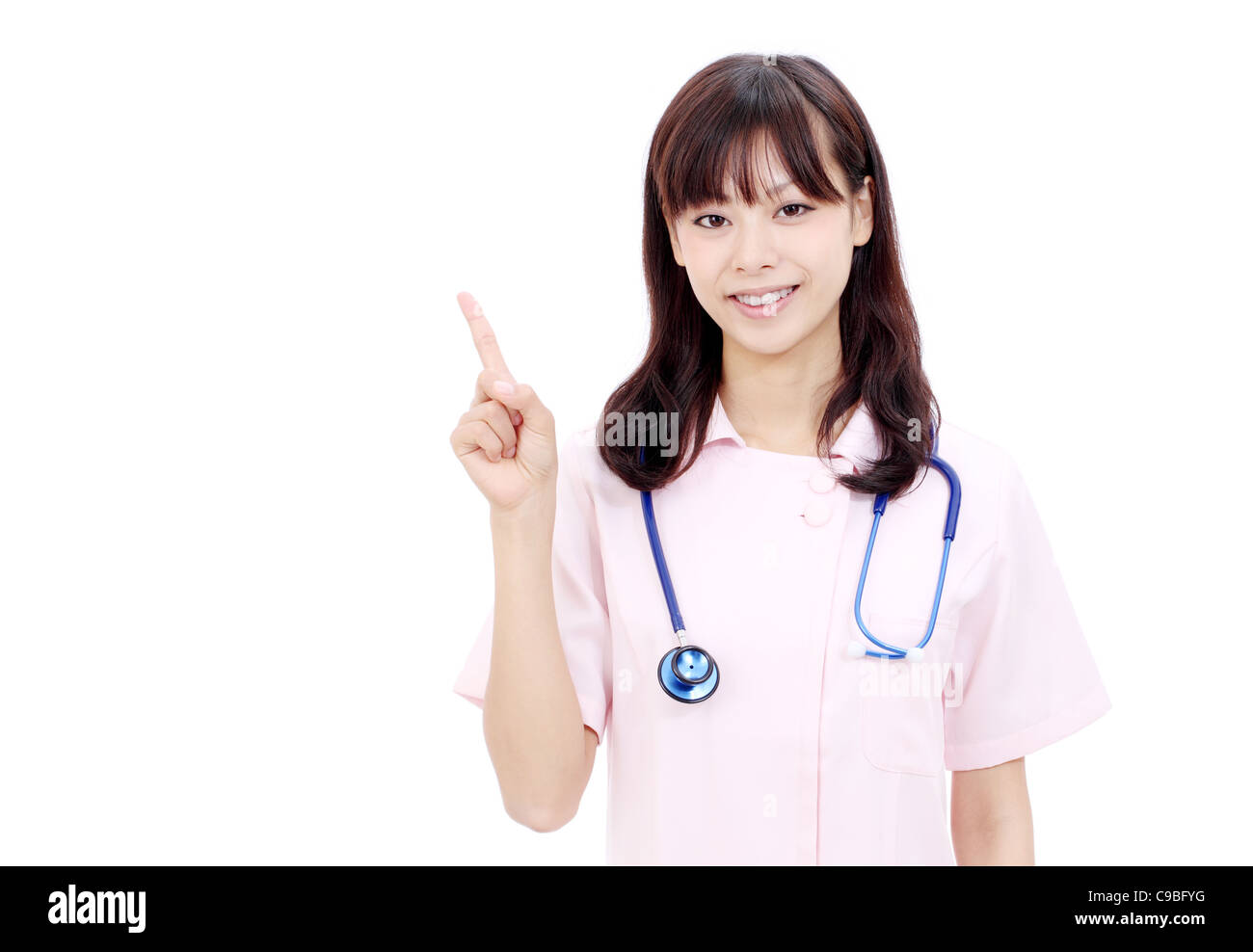 Portrait of happy young asian female nurse pointing Stock Photo - Alamy